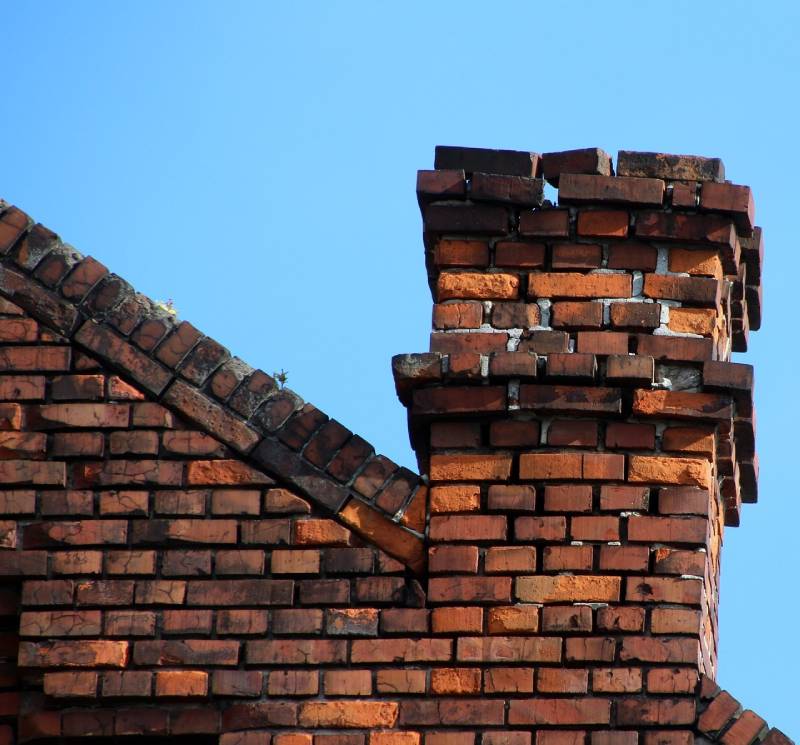 Signs Your San Marcos Home Needs a Chimney Inspection Damaged chimney on an San Marcos home showing cracks and missing mortar